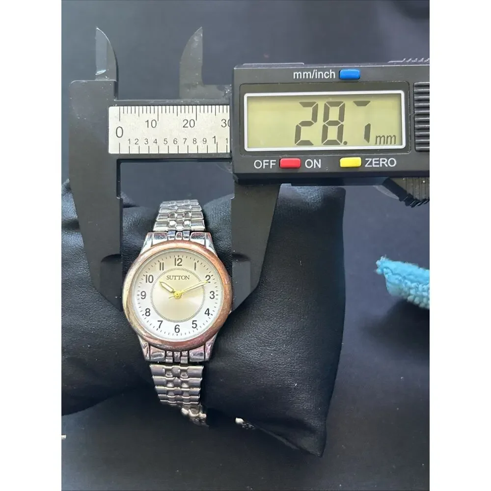 Sutton Silver Tone Worn Bronze Tone Bezel Women’s Stretch Band Quartz Watch